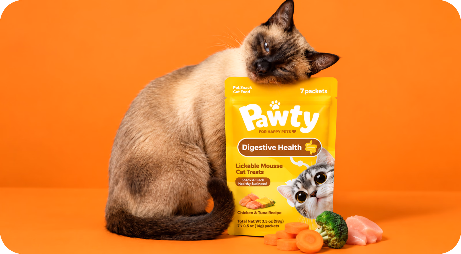 Siamese cat leaning on a Pawty Digestive Health pouch next to carrots and chicken